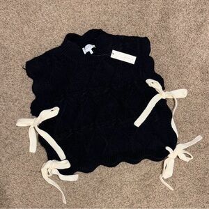 Black Sweater Vest with White Ties
